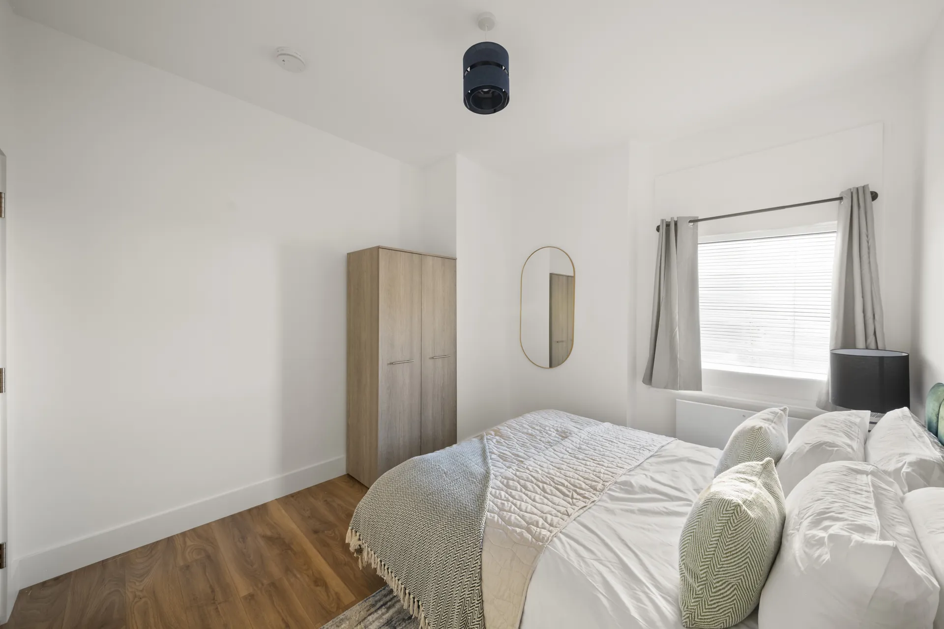 The second bedroom, with its own wardrobe and window