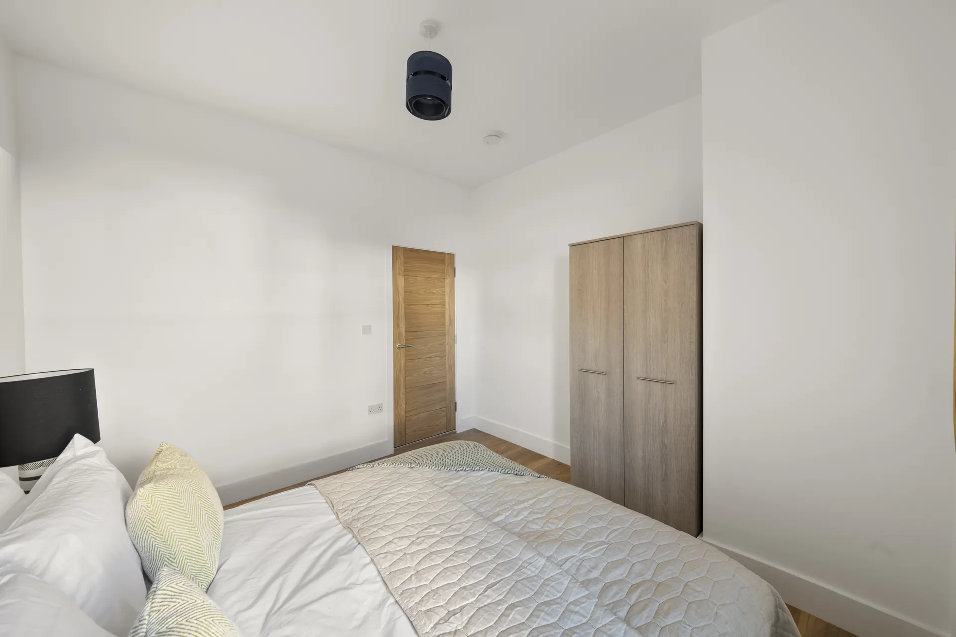 Room to walk around the bed on both sides