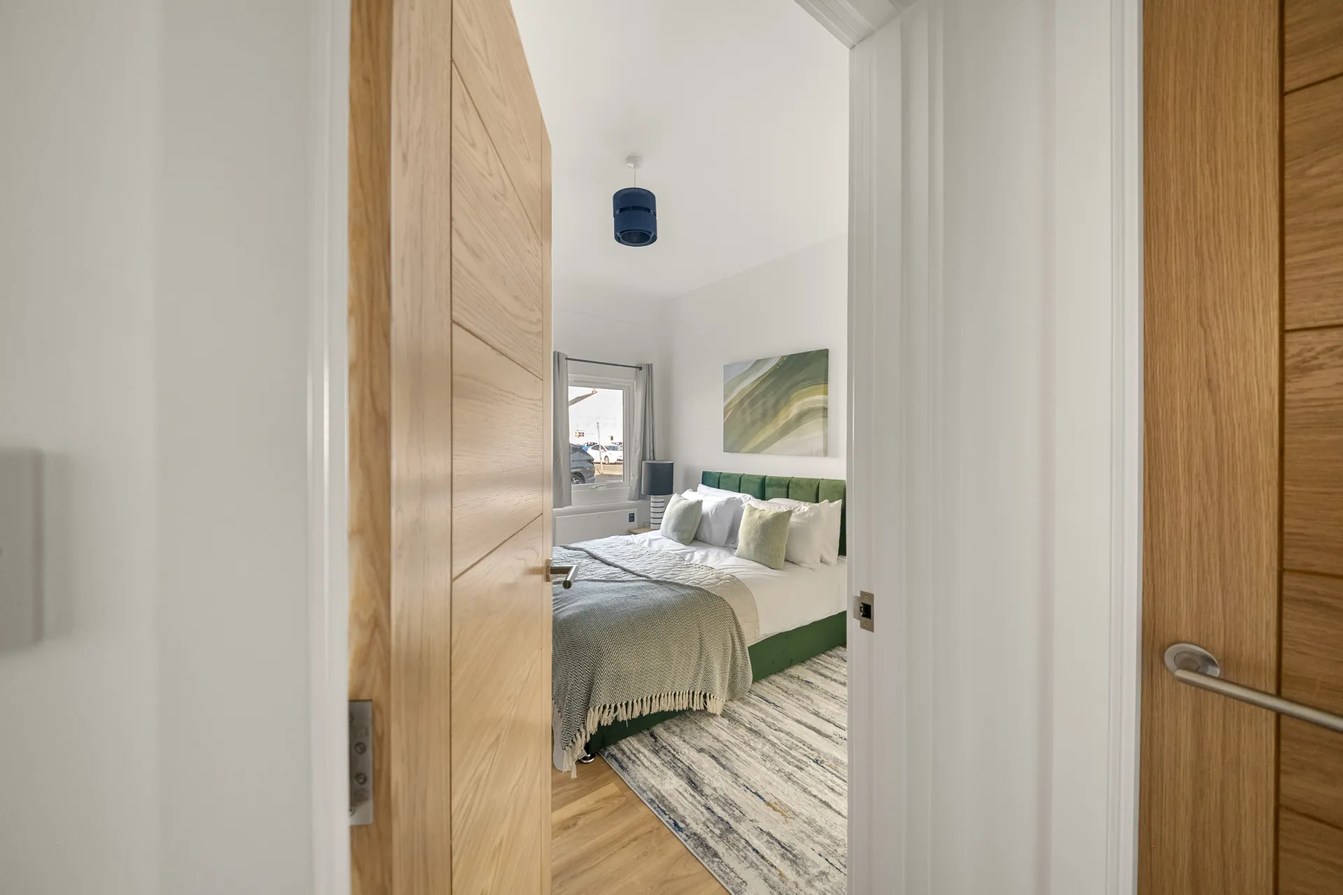 The hallway, looking through to a bedroom