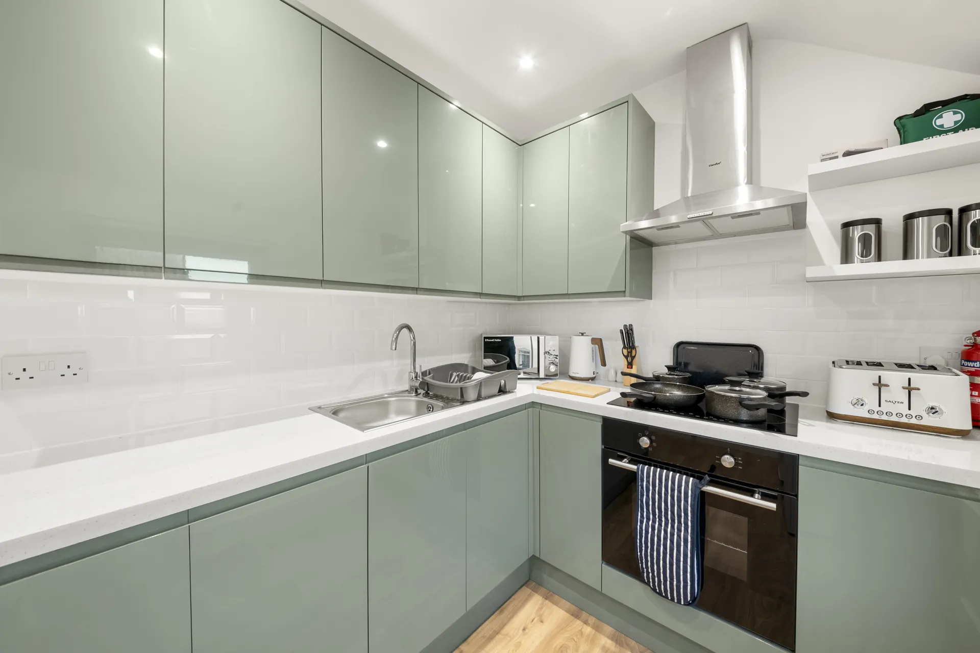 The kitchen: oven, hob, extractor and a generous run of worktop
