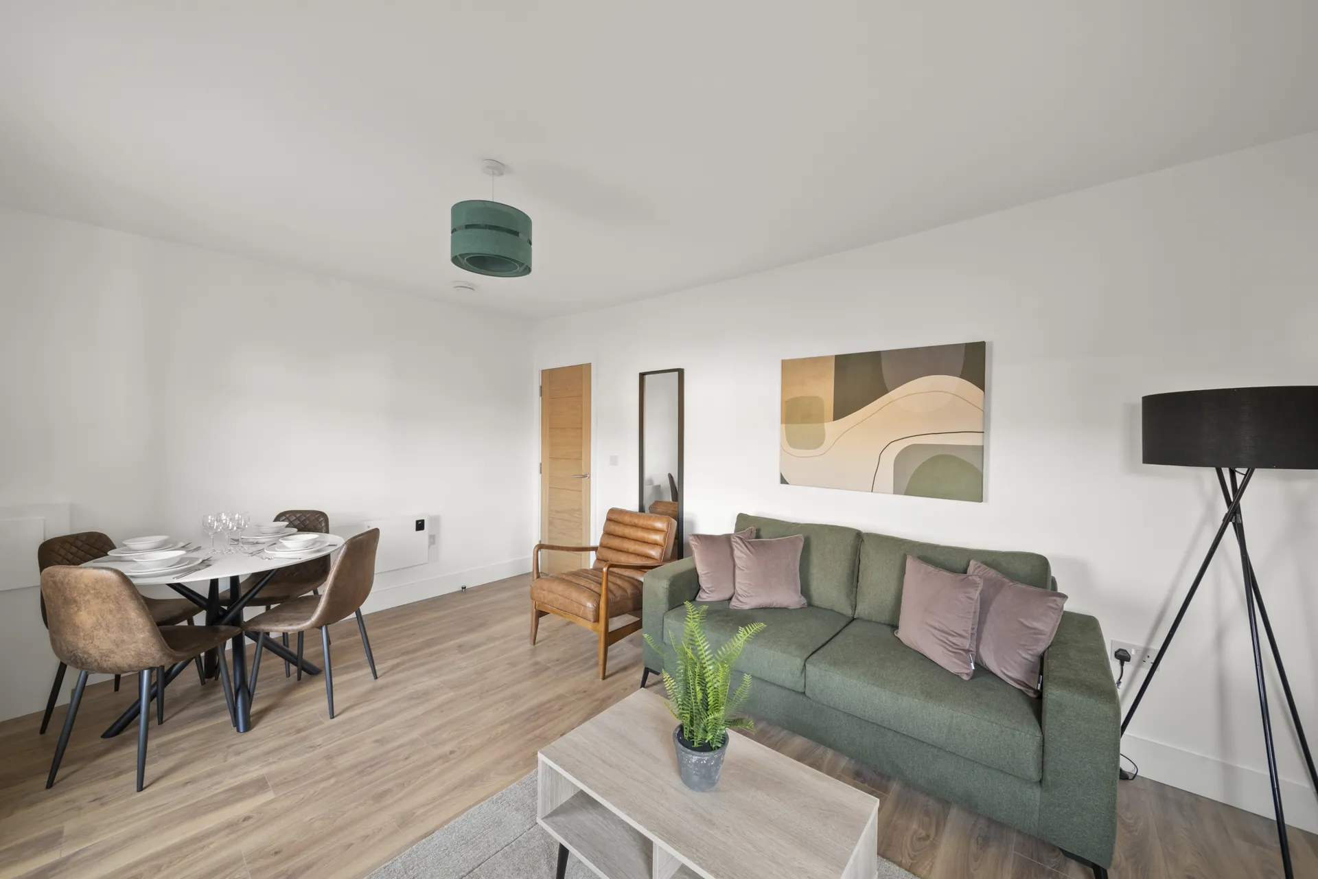 Dining for four with the living space running alongside